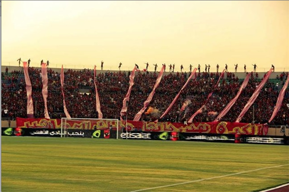 [A message from members of the Ultras Ahlawy (UA), supporters of al-Ahly club, in the stadium, reads “Football and the terraces are fans’ property”. Photo from UA facebook page]