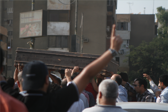 [Funeral of \"Mahmoud Sobhy\", one of the thirty casualties killed on Friday, Nasr City, Egypt. Image originally posted to Mada Masr by Sarah Carr]