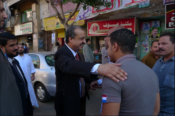 [Mohamed El-Beltagy campaigns in his district in the Shobra el-Khaima neighborhood of Cairo two days before the parliamentary election on 26 November 2010. Image originally posted to Flicker by Al Jazeera English]