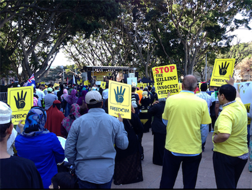 [1 September 2013, Morsi supporters arranged protests in different parts of the world and this photo is \"anti-coup\" demonstration, and show their solidarity with Rabea. The indication of the number \"four\" is for \"Rabea\", Sydney, Australia. Image originally posted to Flickr by Eye on radicals]