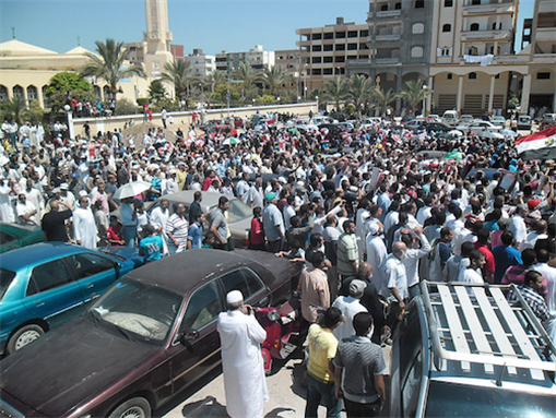[5 July 2013, Morsi supporters protesting the coup and chanting for the legitimacy of the former president Mohamed Morsi, Damietta, Egypt. Image originally posted to Wikimedia Commons]