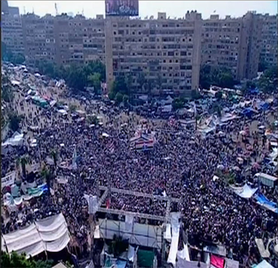 [28 July 2013, pro-Morsi protest in Rabea Al-adwiya Square, Egypt. Image originally posted to Wikimedia Commons]