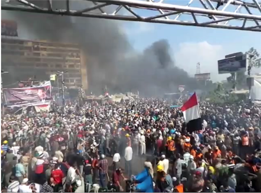 [14 August 2013, Rabea Al-Adawiya during the aggressive dispersal of the pro-Morsi set-in. Image originally posted to Wikipedia]