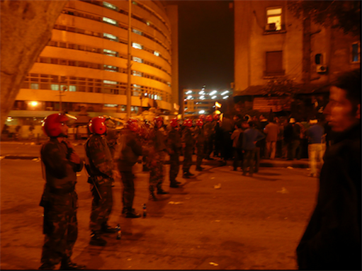 [28 January 2011, security forces guarding state TV building, Egypt. Image originally posted to Flickr by Al jazeerah English]