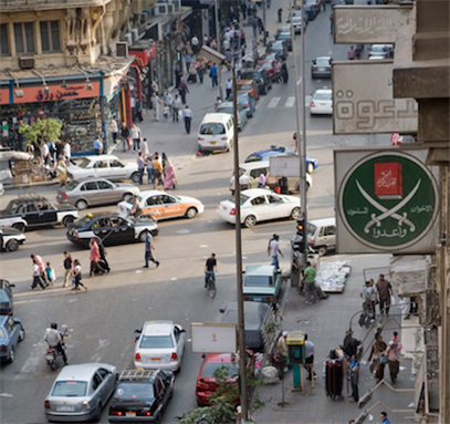 [Muslim Brotherhood logo hanging on the former Brotherhood Headquarters on El-Tawfiqiya Street, Cairo, Egypt. Image originally posted to Flicker by Hossam El-Hamalawy]