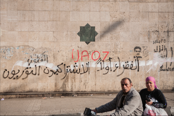 [25 January 2013, graffiti in Arabic reads: \"the poor first, Revolutionary Socialists\". Image originally posted to Flickr by Hossam el-Hamalawy]