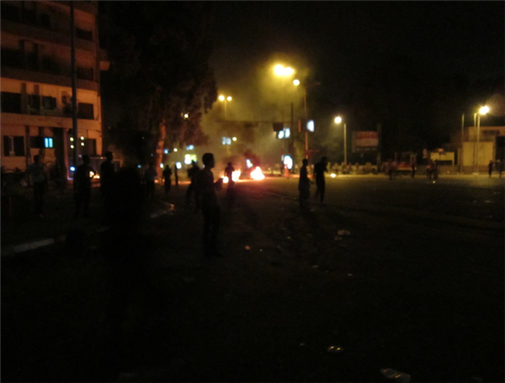 [9 September 2011, police attack in Giza, Egypt. Image originally posted to Flickr by Gigi Ibrahim]