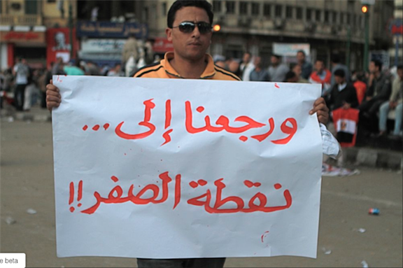 [9 April 2011, protester in dismay of the military rule following 25 January uprising in 2011. The Arabic reads: \"Back to square one.\" Image originally posted to Flickr by Sarah Carr]