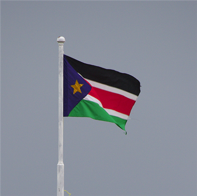 [A South Sudan flag over the airport in Malakal, South Sudan. Image from Owen Fuller/Flickr.]