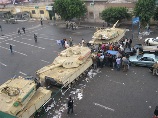 [4 February 2011, army barricading entrance to Tahrir Square, Cairo, Egypt. Image originally appeared on Flickr by ARK88.] 
