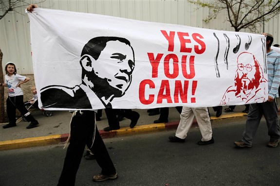 [Israeli protesters carry a banner in March 2013 calling for the release of Jonathan Pollard, a Jewish American who was jailed for life in 1987 on charges of spying on the United States. Image by Tsafrir Abayov via Associated Press]