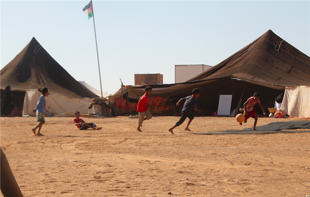 [Young Sahrawi refugees play soccer in the Dakhla refugee camp. Image by Samia Errazzouki.]