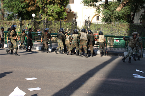 [1 August 2011, army beats a protester. Image originally posted to Flickr by Nora Shalaby.]