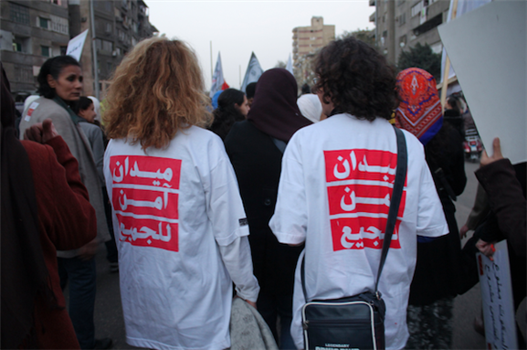 [6 February 2013, anti sexual harassment march to Tahrir Square. The Arabic reads, in reference to Tahrir Square: \"Space safe for everyone.\" Photo courtesy of Gigi Ibrahim via Flickr.]