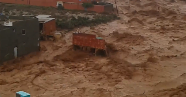 [Screenshot from a video of a home getting destroyed in Guelmim, Morocco due to major recent flooding. Image from video uploaded by Ali Bedar on Facebook]