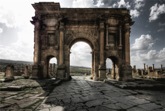 [Image of the Arch of Trajan in Timgad, Algeria. Image by zedamnabil/Flickr]