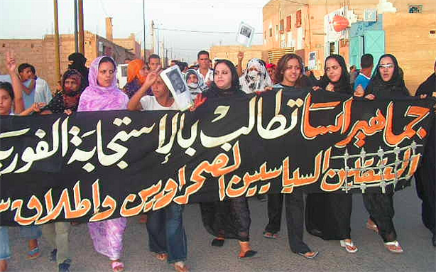 [Image of a demonstrated in Assa, Western Sahara calling for the release of Sahrawi activists imprisoned by Moroccan authorities]
