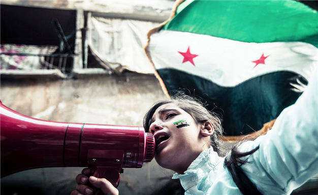 [Image of children chanting Syrian freedom songs in Aleppo, Syria. Image by Freedom House via Flickr]