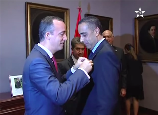 [Abdellatif Hammouchi receives decoration from the Spanish government. Image from screenshot of Moroccan state channel, Al Oula.]