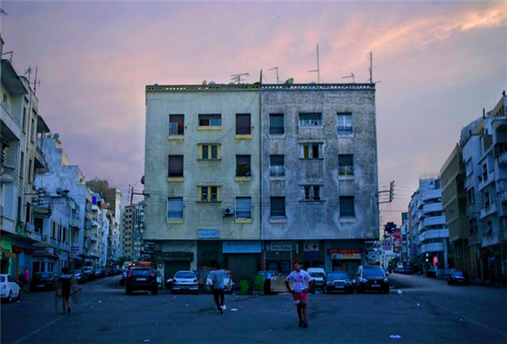 [Image of a building facade in Casablanca. Image by Nadir Bouhmouch]
