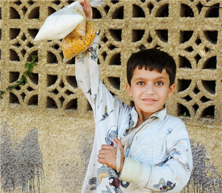 [Image of a Syrian boy in besieged Hameh. Image by Dimashqi Lens via Flickr]