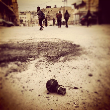 [Palestinian children walked to school through clouds of teargas in Hebron after Israeli Defense Force fired four canisters into a busy street. Photo by CPT Palestine from Flickr]