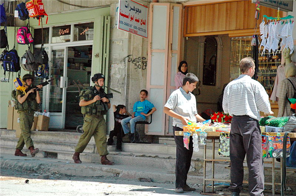 [Israeli soldiers in Hebron. Picture taken and uploaded by Justin McIntosh via Wikimedia Commons]