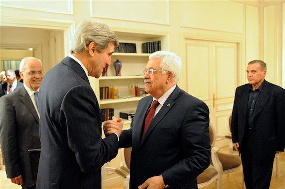 [U.S. Secretary of State John Kerry and Palestinian Authority President Mahmoud Abbas shake hands before a meeting in Paris, France, on February 19, 2014. Image by State Department / Public Domain.]