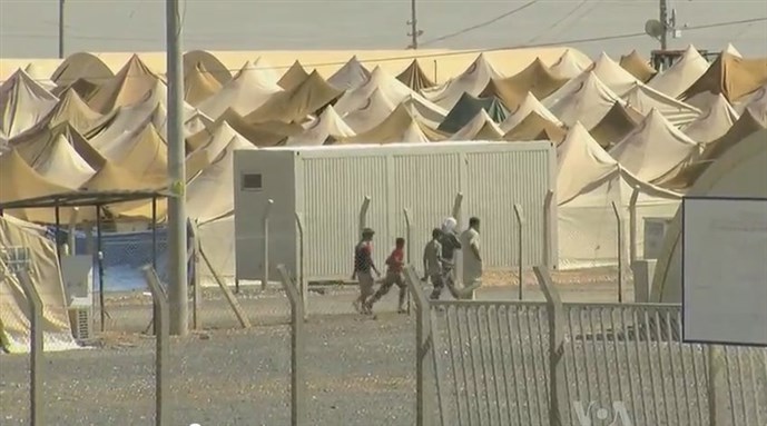 [A Syrian refugee center on the Turkish border. Image from Wikimedia Commons.]