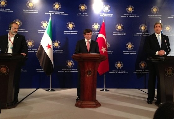 [Ahmet Davutoglu with John Kerry and Moaz al-Khatib, Istanbul, 20 April 2013. Image via Wikimedia Commons.]