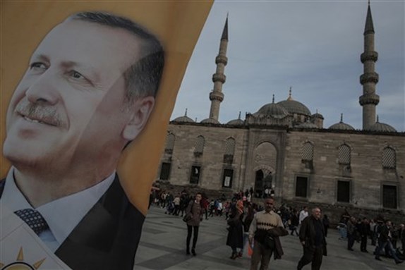 [Poster of Prime Minister Erdogan on an election billboard in Istanbul, 27 March. (AP Photo/Emrah Gurel)]