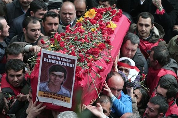 [People carry the coffin of Berkin Elvan during his funeral in Istanbul, 12 March 2014. The placard reads: \"Berkin Elvan is immortal!\" Photo by Emrah Gurel/AP Photo]