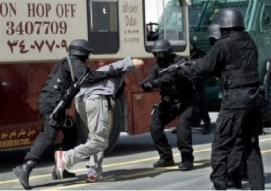 [Emirati security forces crackdown on activists in Dubai, 2012. Image from Gulf Center for Human Rights.]