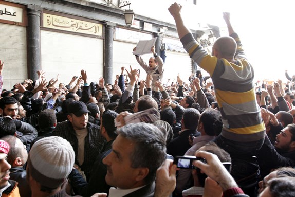 [Protesters near the Umayyad Mosque in Damascus. Image from AP]
