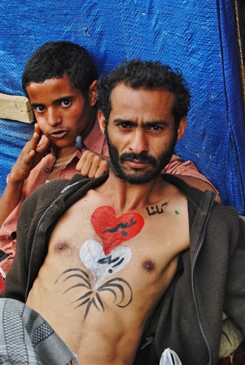 [\"We Are All Abd Rabbo\" says message on the chest of protester in Sana`a`s Change Square, 21 February 2012. Photo by Atiaf Alwazir.]