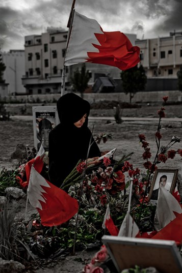 [Visiting the grave of Martyr Sayed Jawad Sayed Hashim in Sitra. Image from Saeed Saif, March 2012]