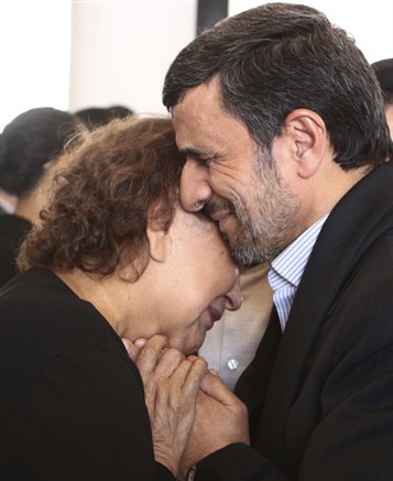 [The photo that kickstarted a firestorm--Ahmadinejad embraces Elena Frias, the mother of Hugo Chavez, during the funeral of the late Venezuelan President. Image from Miraflores News Service]