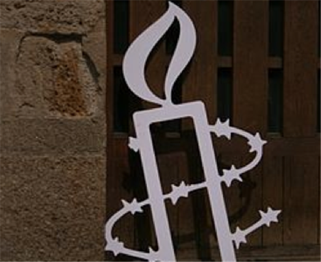 [Amnesty International symbol. Image by Tamorlan via Wikimedia Commons] 