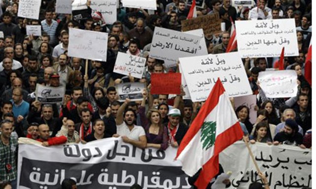 [Protestors in Lebanon, \"For a Democratic Secular State.\" Image from unknown archive.]
