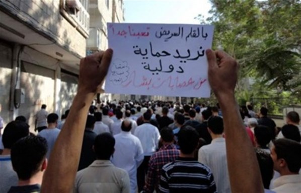 [Protester in support of intervention in Saqba. Image by Manuel via Google Images] 
