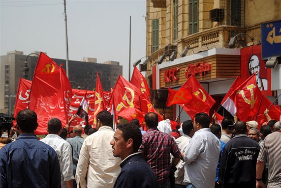 [Members of Egyptian Communist Party in Tahrir Square. Image from Wikimedia Commons]