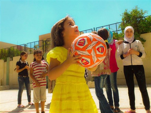 [Displaced children in a Damascus schools playing. 22 August 2012. Via Lens Young Dimashqi.]