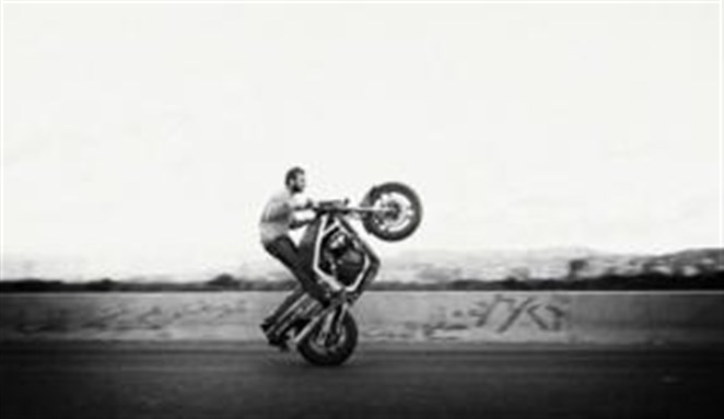 [The Stunt Biker by Walid Rashid. Copyright by permission of photographer, www.walidrashid.com]