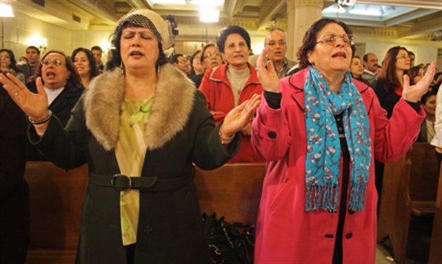[Egyptians celebrate Christmas at Kasr El-Doubara church near Tahrir Square. Image from Ahram Online.]