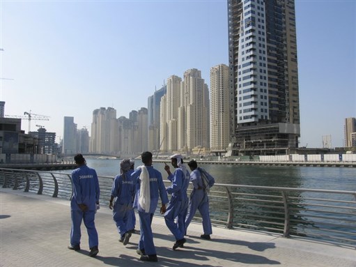 [Migrant workers in Dubai. Image from Wikipedia]