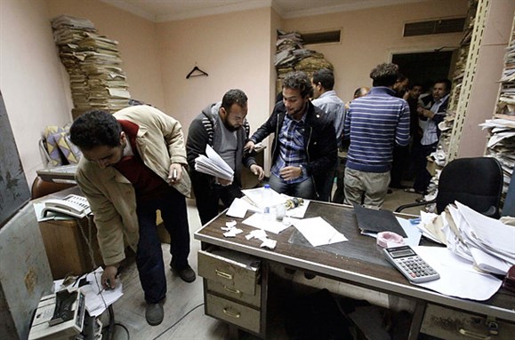 [Protesters stormed state security building on 5 March 2011 to uncover information collected in secrecy about activists and political opposition. Image by Mohamed Abd El-Ghany/Reuters]