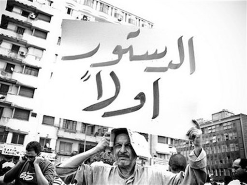 [Protester demanding \"Constitution First\" in Egypt. Image by Maggie Osama via Flickr]