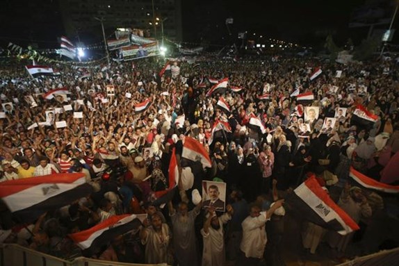 [A pro-Morsi rally in Cairo this week. Photo by Hussein Malla/AP]