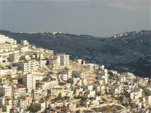 [East Jerusalem and Separation Wall in background. Image by Anthony Baratier via Wikimedia Commons[