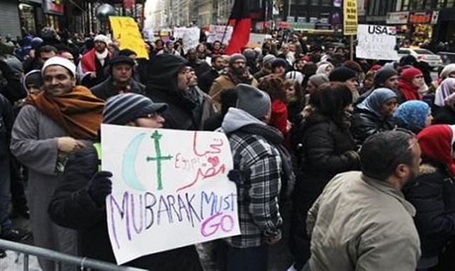 [Expat Egyptians in solidarity with Tahrir Square Sit-In. Image from Reuters.]